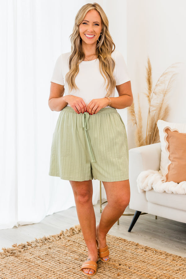 Chic Soul plus size clothing, sage green drawstring casual shorts with faint vertical stripe pattern and pockets