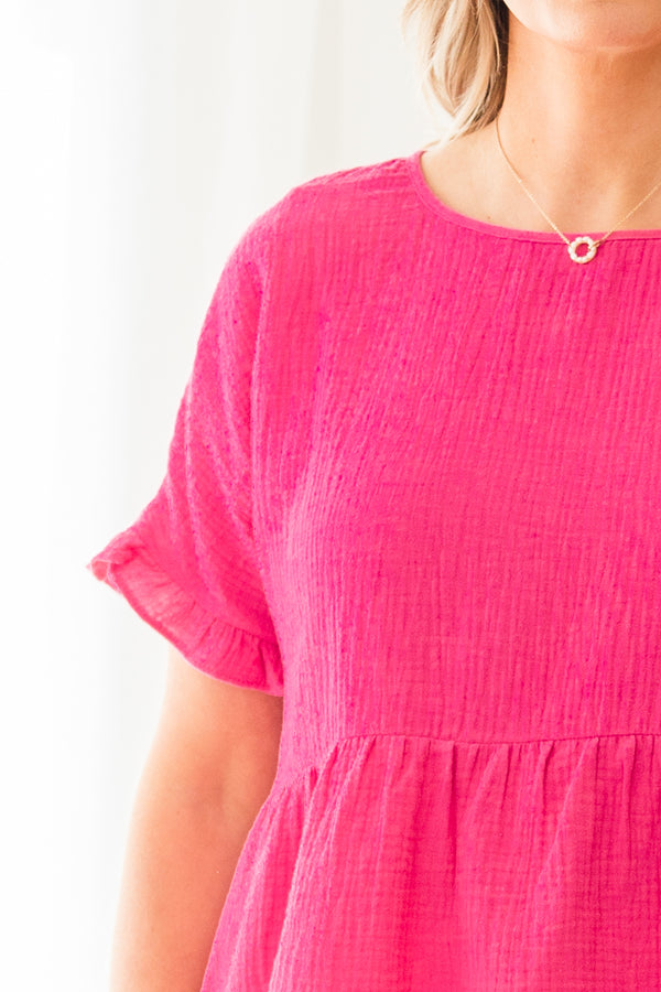 Plus Size pink cotton gauze babydoll top with ruffle short sleeves and a round neckline.