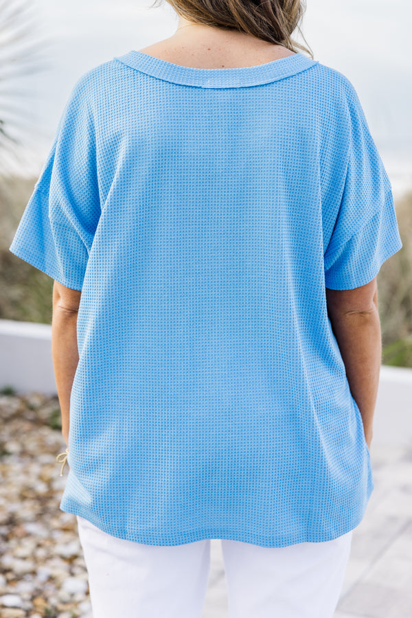 Chic Soul plus size clothing, ocean blue short sleeve top with a three buttons on the v-neckline and a waffle textured pattern 
