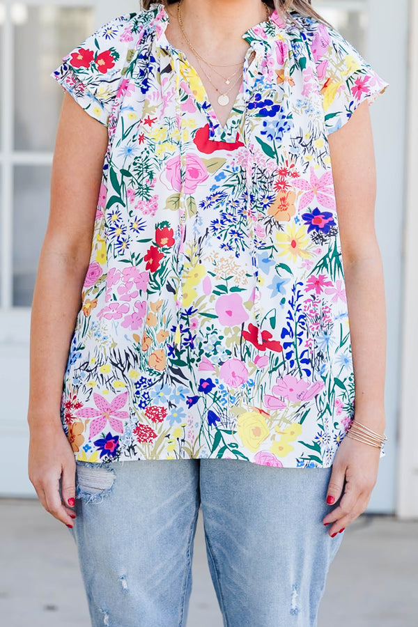 Chic Soul plus size clothing, off white short sleeve top with v cutout on neckline with tie detailing and multicolored floral print