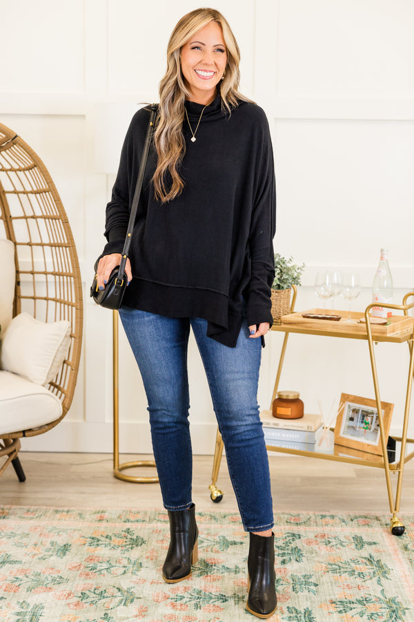 Chic Soul plus size clothing, black long sleeve flowy top with ribbed cuff sleeves with ribbed band along the bottom with slit with cowl turtleneck detail