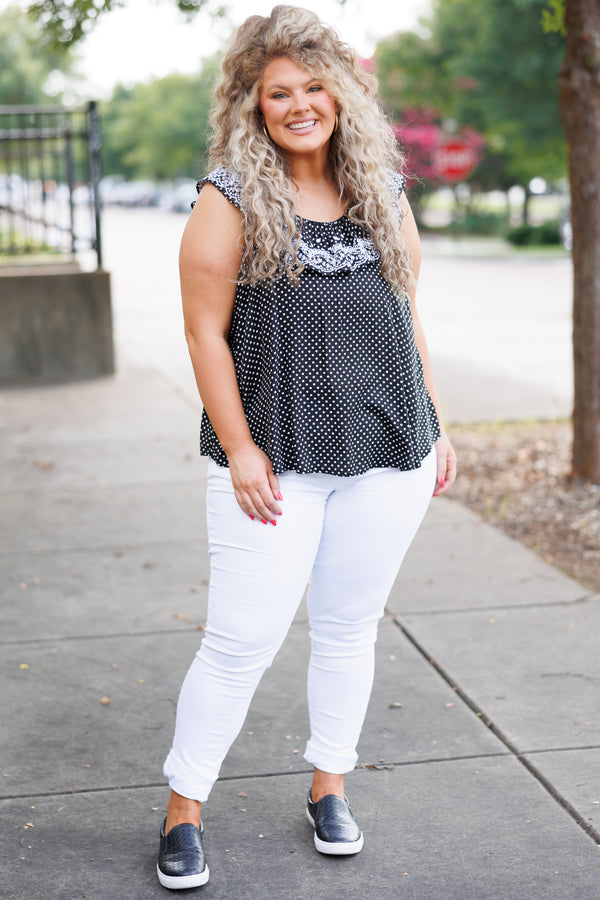 Chic Soul plus size clothing, black flowy top with white polka dot pattern and ruffles and lace embroidery on neckline