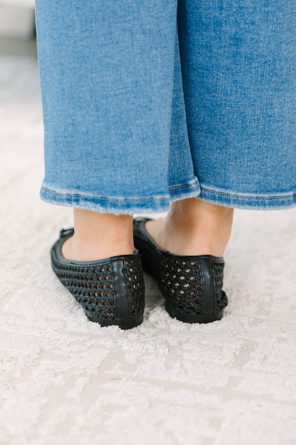 Plus Size black woven mesh ballet flats with a small bow detail paired with blue denim jeans.