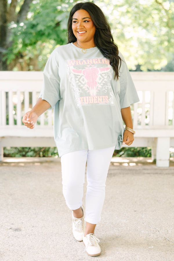 Plus size light sage boyfriend tee with a pink western bull skull graphic and flowy oversized fit.