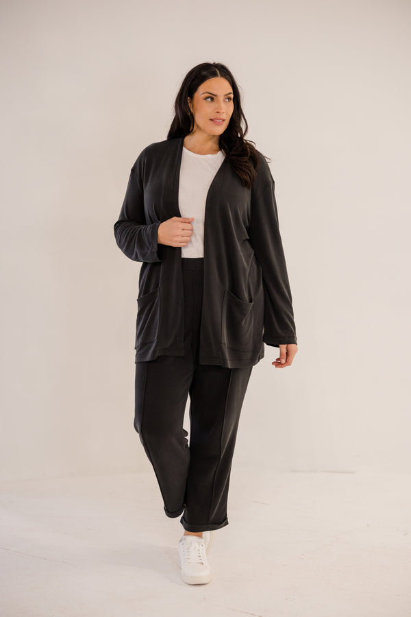 Chic Soul plus size clothing, black long sleeve minimal flowy cardigan with side pockets in the front