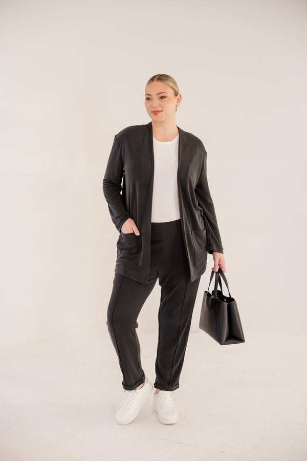 Chic Soul plus size clothing, black long sleeve minimal flowy cardigan with side pockets in the front