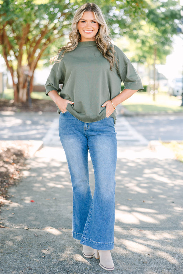Plus size high-rise flare jeans in a medium wash denim with a stretchy, flattering fit.
