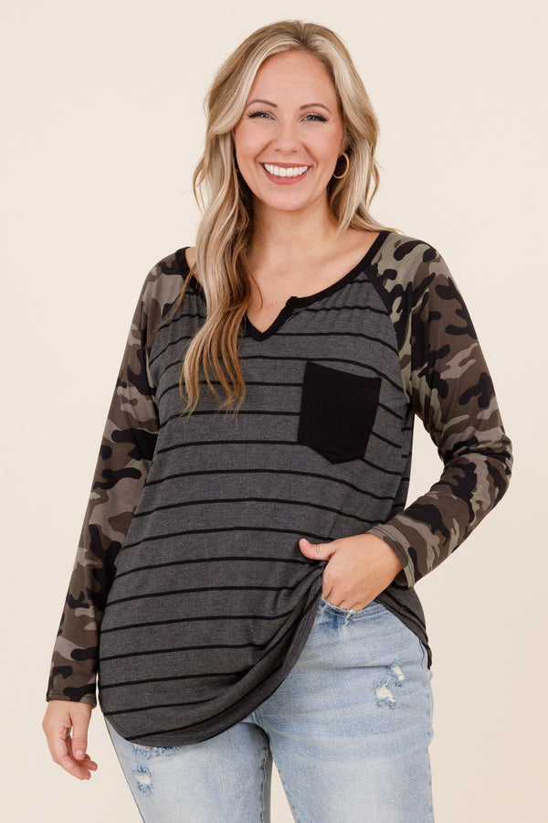 Chic Soul plus size clothing, olive colored top with grey and black stripes and faux camo sleeves and small pocket on left side of the chest and micro v neck detailing
