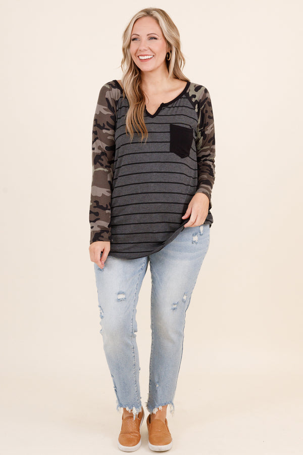 Chic Soul plus size clothing, olive colored top with grey and black stripes and faux camo sleeves and small pocket on left side of the chest and micro v neck detailing