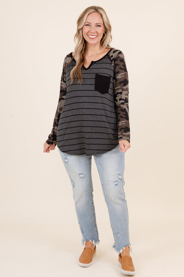 Chic Soul plus size clothing, olive colored top with grey and black stripes and faux camo sleeves and small pocket on left side of the chest and micro v neck detailing