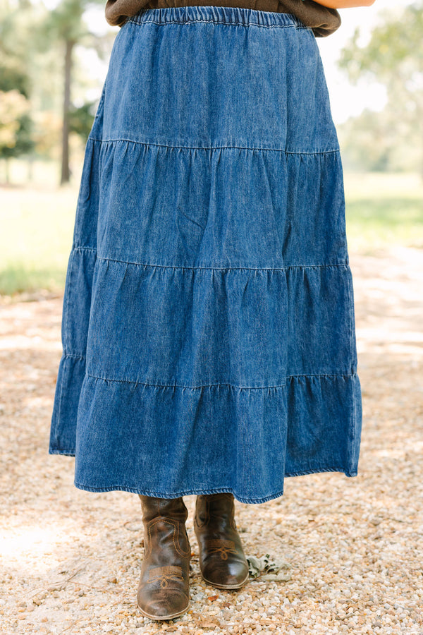 Plus size dark wash denim tiered maxi skirt with a comfortable elastic waist and flowy silhouette.