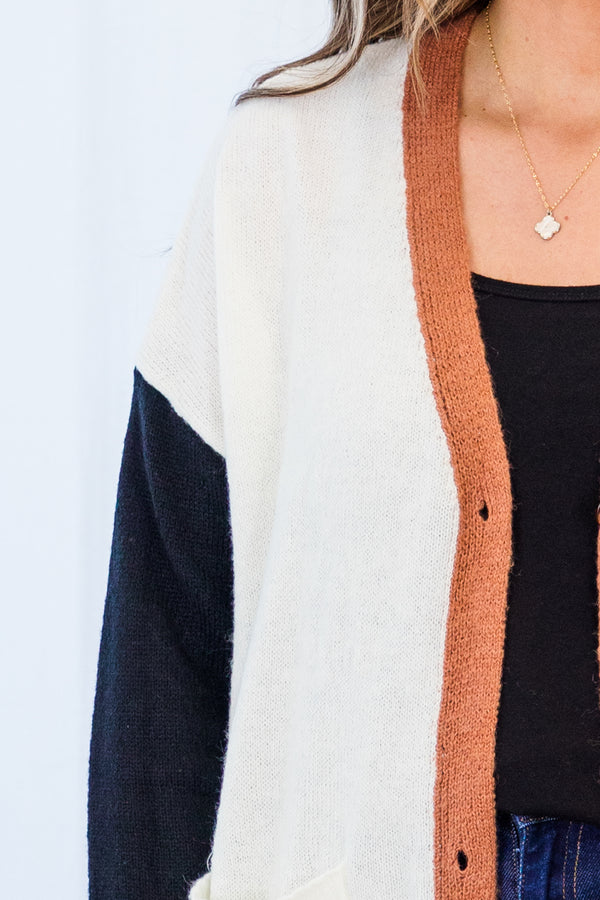 Chic Soul plus size clothing, long-sleeve white cardigan outlined with orange rust with black sleeves with orange rust button detailing 