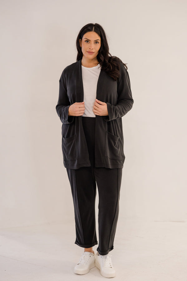 Chic Soul plus size clothing, black long sleeve minimal flowy cardigan with side pockets in the front