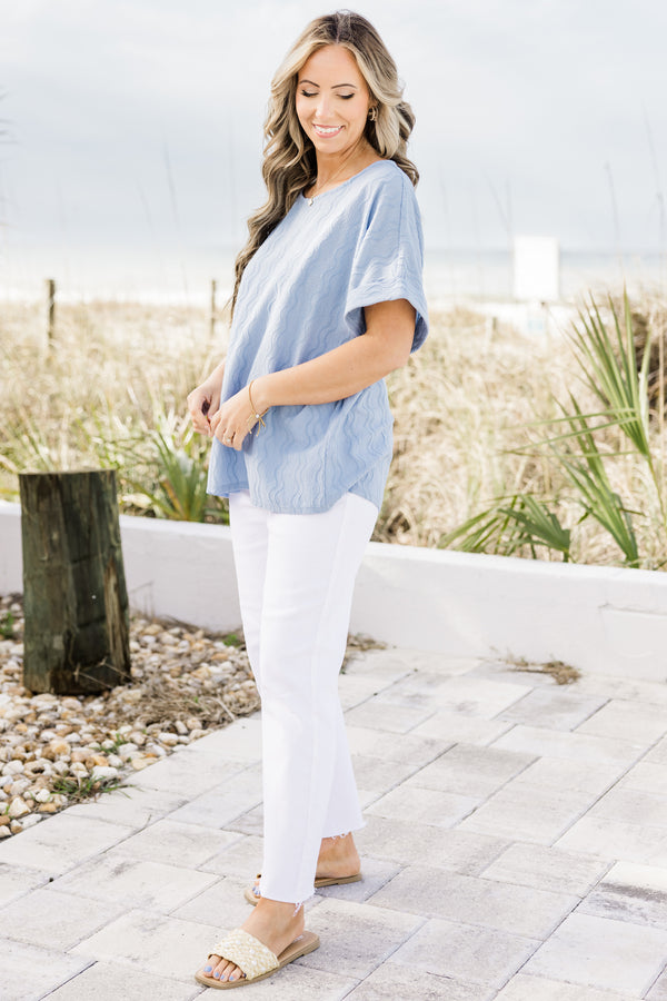 Plus Size sky blue ripple textured top with a round neckline and cuffed short sleeves.