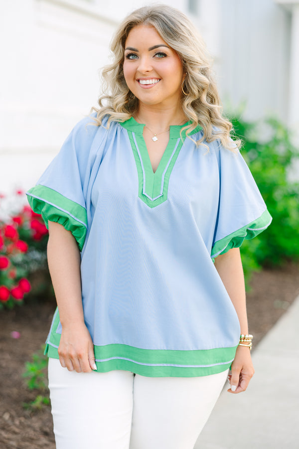 Chic Soul plus size clothing, blue short sleeve top with v cutout along neckline with puff sleeves with kelly green trim along sleeves, neckline, and bottom