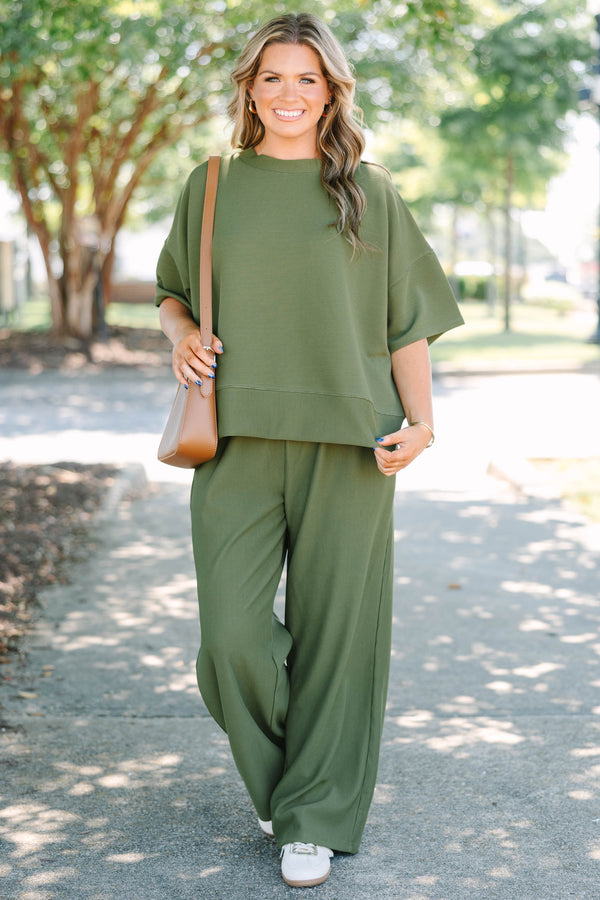 Plus Size olive green ribbed knit set featuring a short sleeve crewneck top and wide-leg pants.