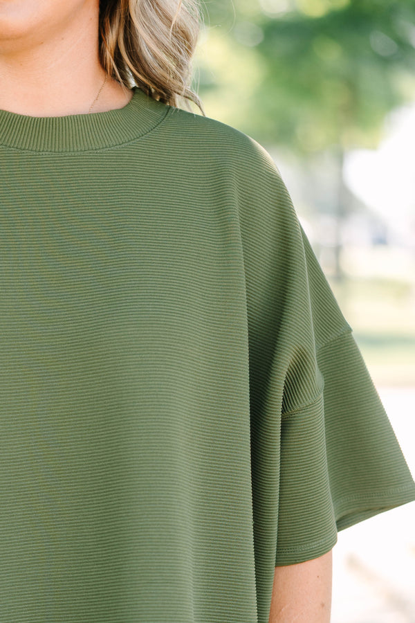 Plus Size olive green ribbed knit set featuring a short sleeve crewneck top and wide-leg pants.