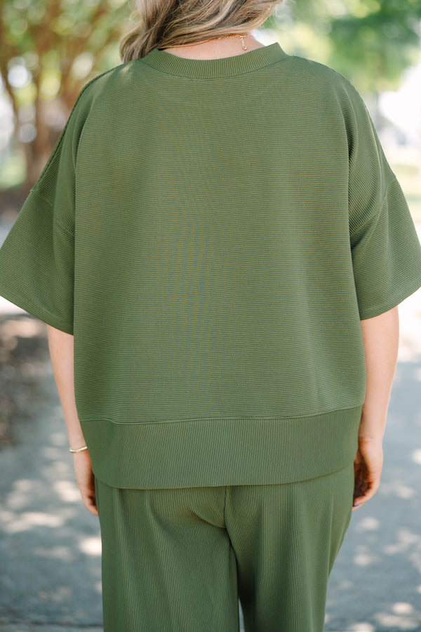 Plus Size olive green ribbed knit set featuring a short sleeve crewneck top and wide-leg pants.
