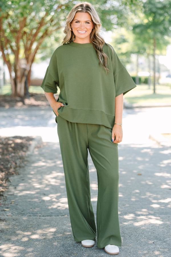 Plus Size olive green ribbed knit set featuring a short sleeve crewneck top and wide-leg pants.