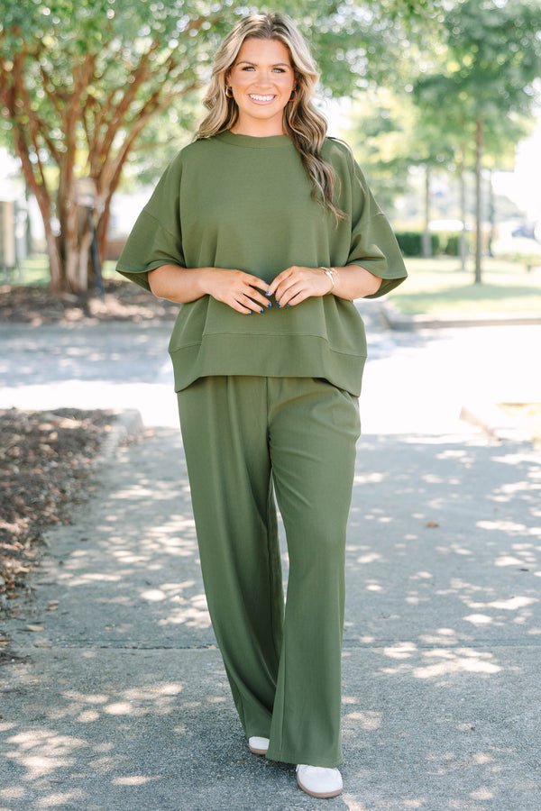 Plus Size olive green ribbed knit set featuring a short sleeve crewneck top and wide-leg pants.