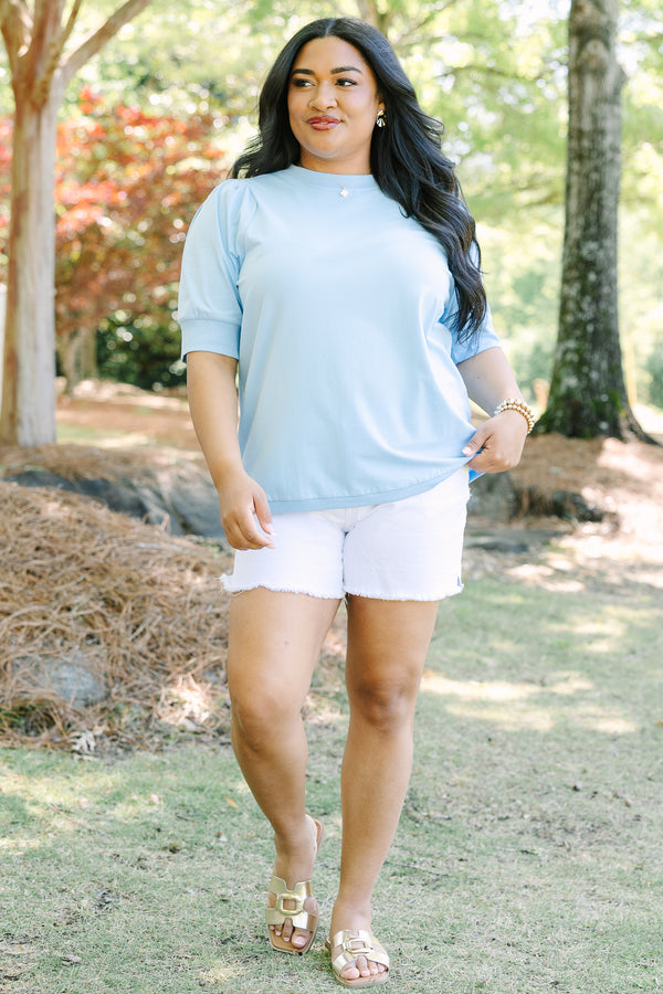 Plus Size light blue short sleeve top with puff sleeves and a crew neckline.