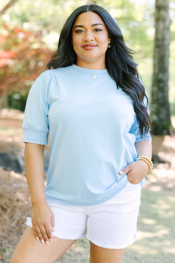 Plus Size light blue short sleeve top with puff sleeves and a crew neckline.