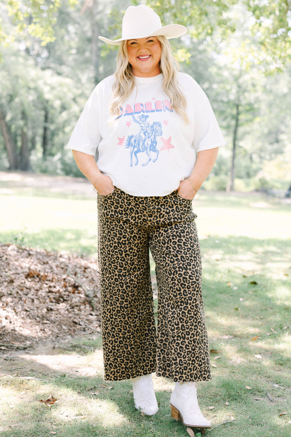 Plus Size white vintage wash graphic tee with a cowboy design and leopard print pants.