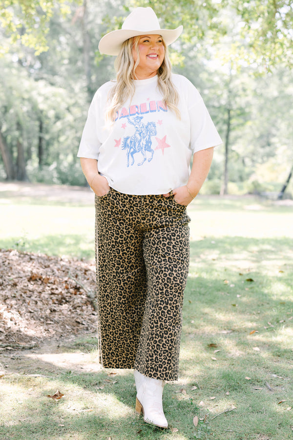 Plus Size white vintage wash graphic tee with a cowboy design and leopard print pants.