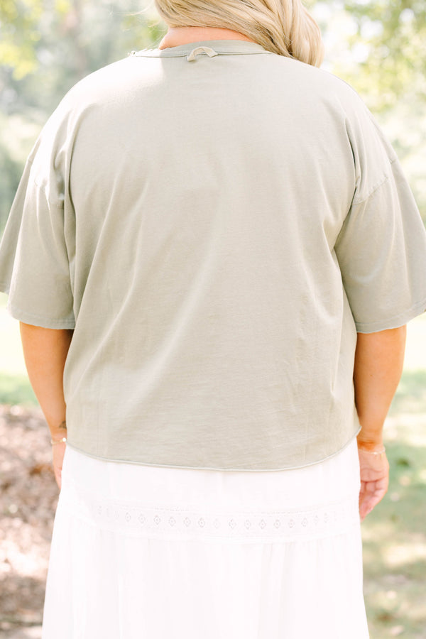 Plus Size army green vintage wash tee with leopard print TEXAS graphic and white lace trim skirt.