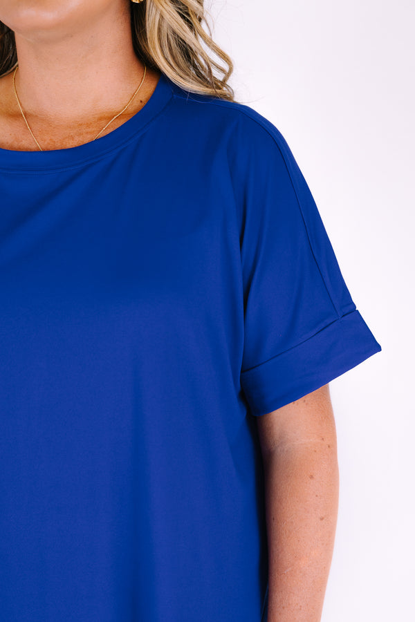 Plus Size bright blue short set with a round neck high-low top and matching biker shorts.