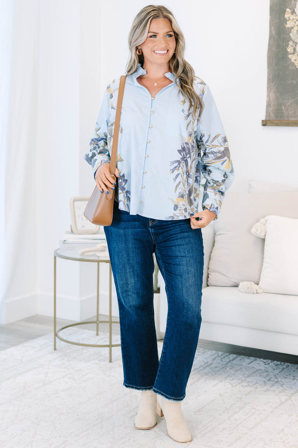 Plus Size light blue button-down cotton blouse with ruffled collar and floral prints on sleeves.