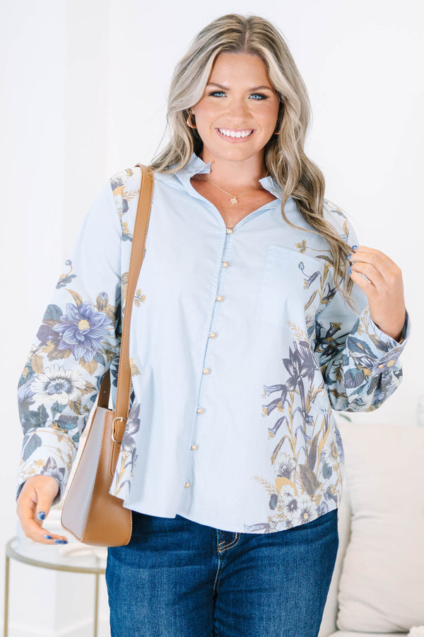 Plus Size light blue button-down cotton blouse with ruffled collar and floral prints on sleeves.