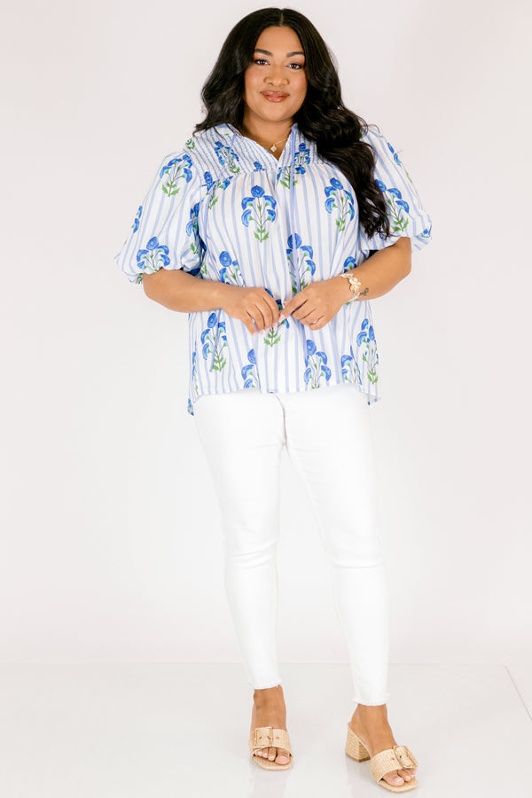 Chic Soul plus size clothing, blue striped top with bubble sleeves a slight v-neckline and a blue floral block print. 