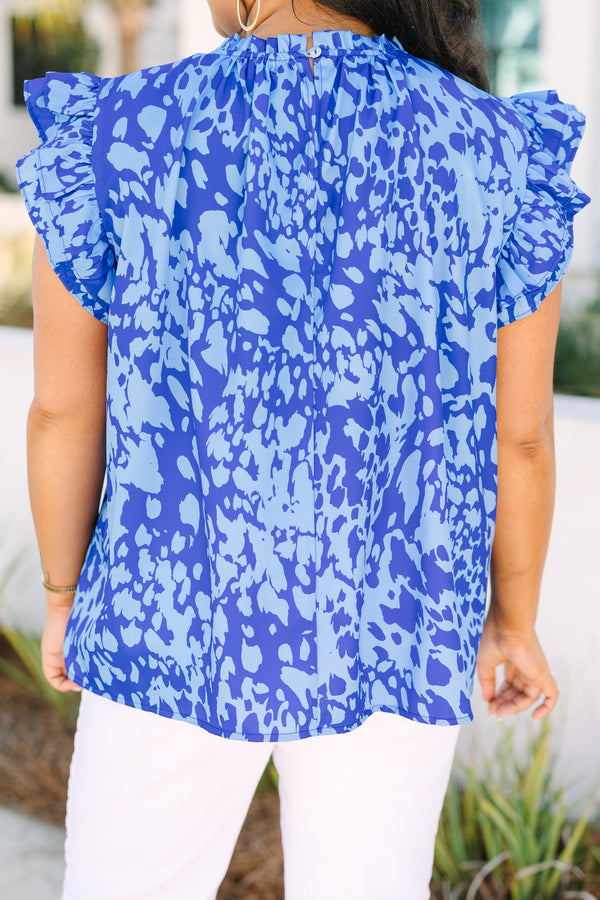 Chic Soul plus size clothing, dark blue ruffle sleeveless top with lighter blue abstract pattern and ruffle around the high neckline