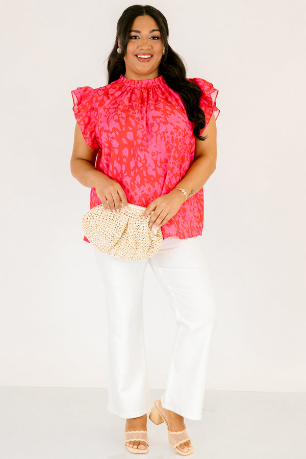 Chic Soul plus size clothing, fuchsia top with a high neck that has ruffle detailing as well as flutter sleeves and a pink abstract pattern throughout 