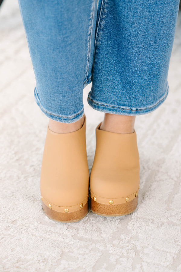 Plus Size apricot clogs with a wooden platform heel, gold stud details, and blue denim jeans.