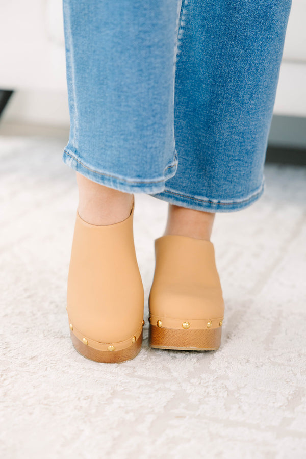 Plus Size apricot clogs with a wooden platform heel, gold stud details, and blue denim jeans.