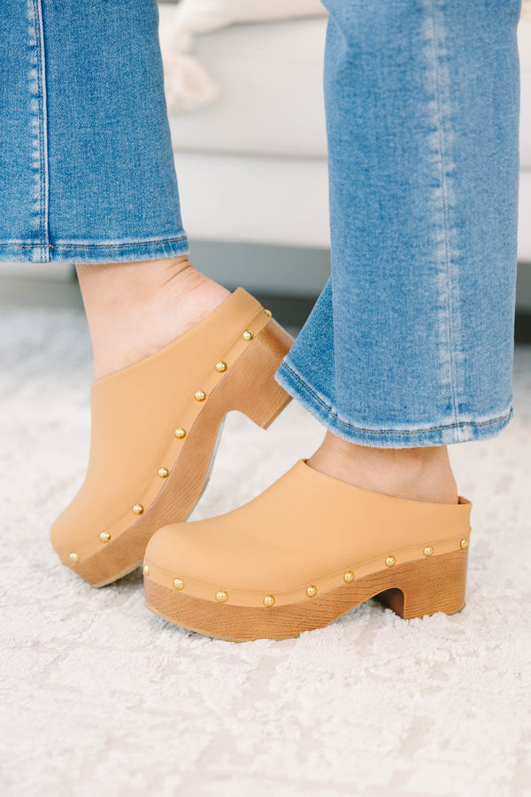 Plus Size apricot clogs with a wooden platform heel, gold stud details, and blue denim jeans.