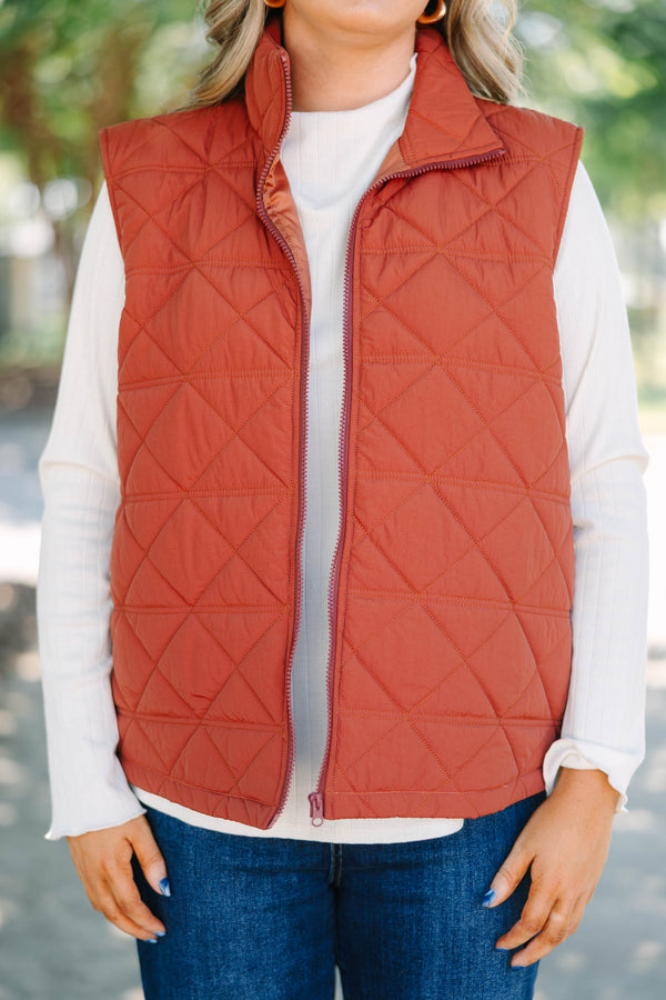 Plus size brown quilted vest with a zip-up front and a cozy, comfortable fit.
