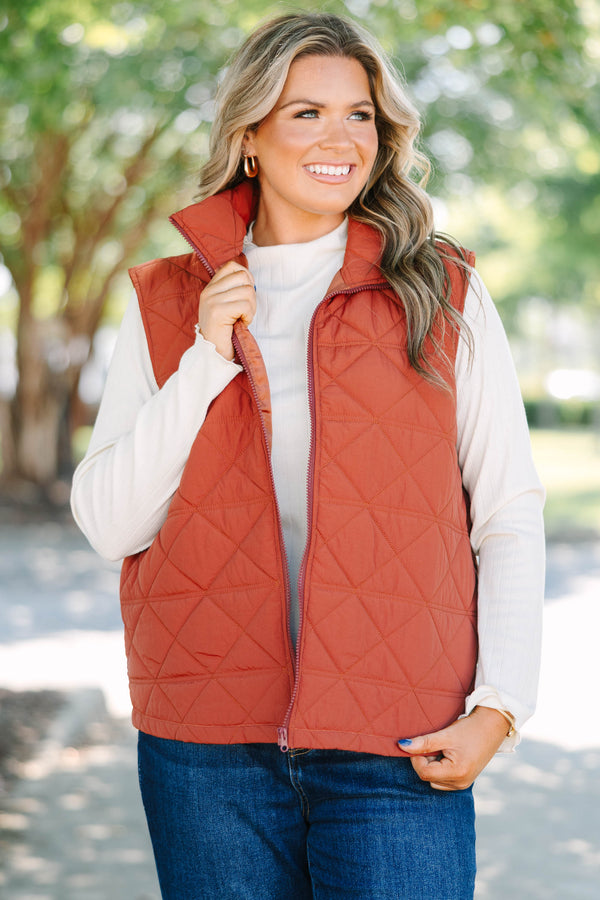 Plus size brown quilted vest with a zip-up front and a cozy, comfortable fit.