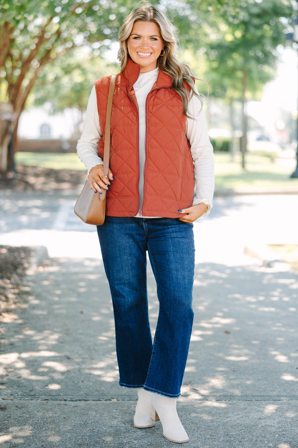 Plus size brown quilted vest with a zip-up front and a cozy, comfortable fit.