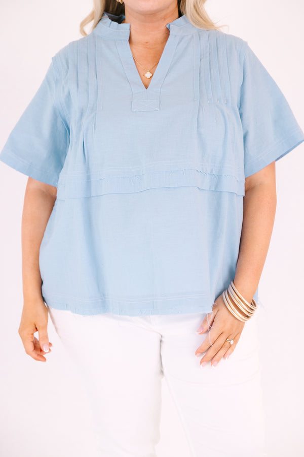 Chic Soul plus size clothing, blue short sleeve top with a v-neckline and an overlay stripe going across the middle of the top 