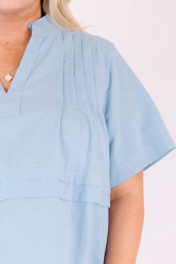 Chic Soul plus size clothing, blue short sleeve top with a v-neckline and an overlay stripe going across the middle of the top 