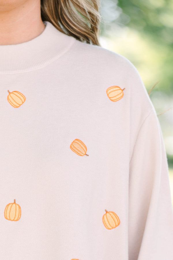 Plus size cozy taupe pumpkin sweater with a flowy fit and wide bell sleeves.