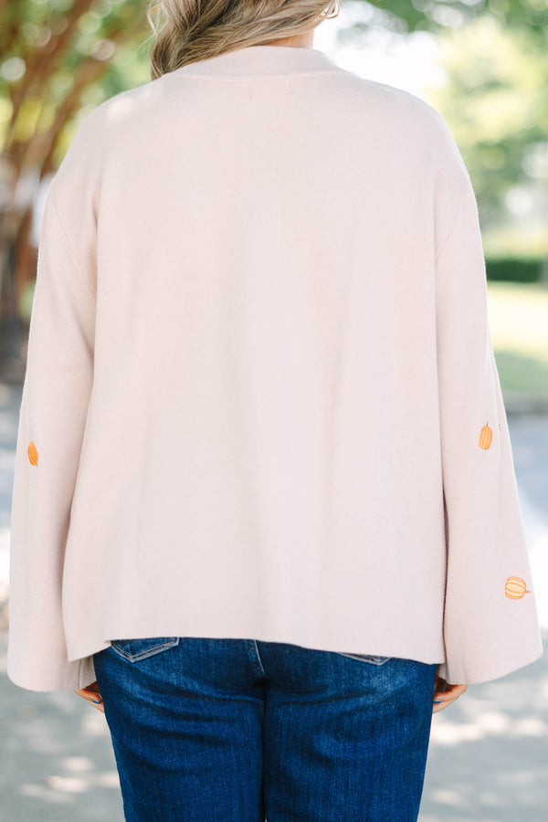 Plus size cozy taupe pumpkin sweater with a flowy fit and wide bell sleeves.