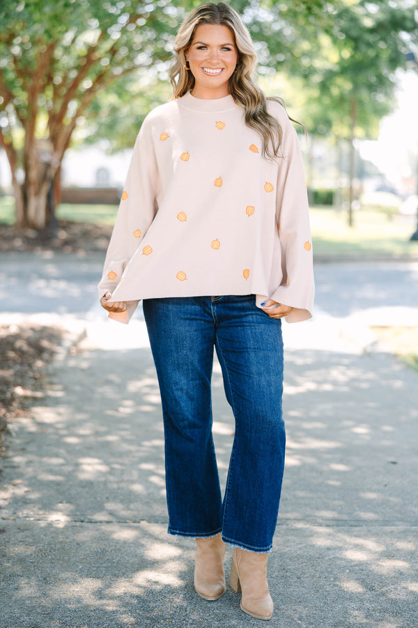 Plus size cozy taupe pumpkin sweater with a flowy fit and wide bell sleeves.