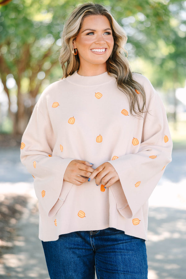Plus size cozy taupe pumpkin sweater with a flowy fit and wide bell sleeves.