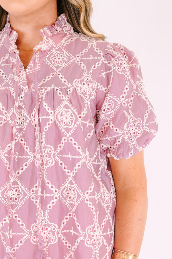 Chic Soul plus size clothing, mauve  short-sleeve blouse with a relaxed, flowy fit, featuring eyelet geometric patterns and a ruffled split neckline with tie tassels