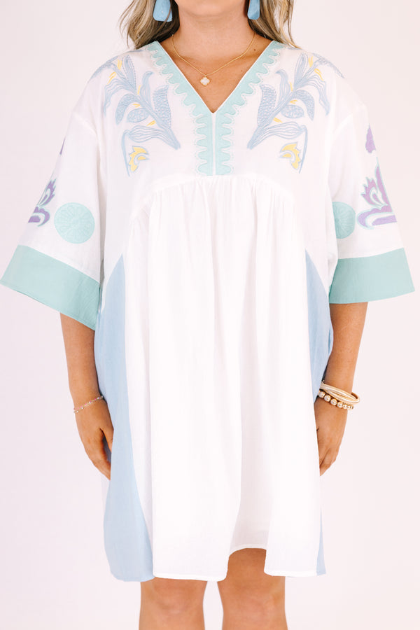 Chic Soul plus size clothing, white knee length dress with seafoam accents on the side of the dress at the end of the sleeves and a seafoam floral pattern on the chest and sleeves area as well as half sleeves and a v-neckline 