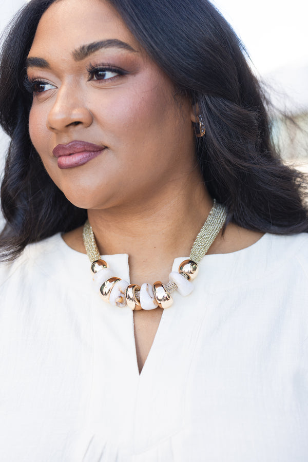 Chic Soul plus size clothing, gold necklace with gold and white marble beads attached to necklace 